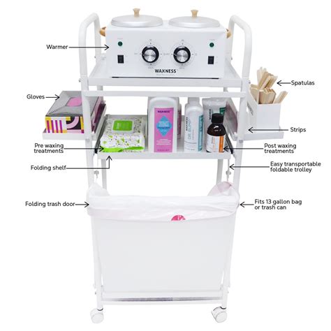 A neatly organized waxing station with a rolling cart, wax warmer, and various tools.