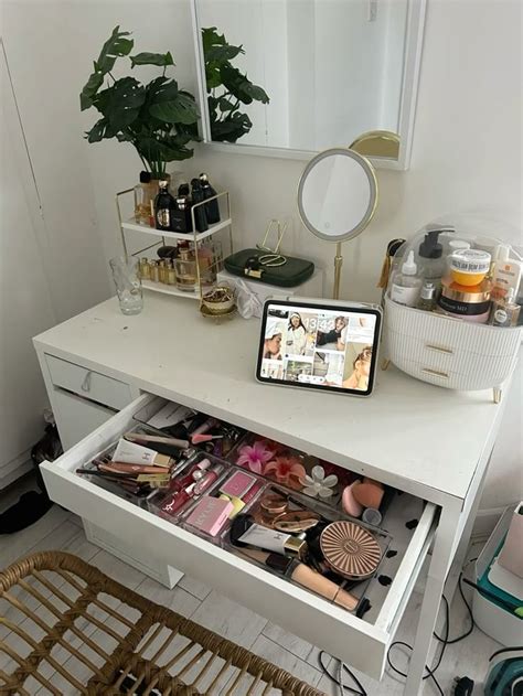 A visual representation of a cluttered makeup vanity before organization.