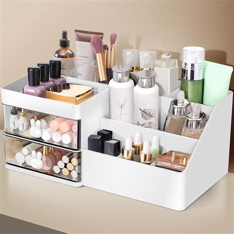 An organized makeup vanity featuring new organizers and a clear countertop.