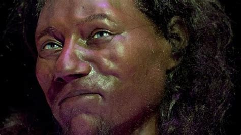 An artist's reconstruction of Cheddar Man, showing his dark skin and blue eyes.