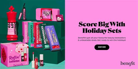 A collection of Benefit Cosmetics holiday makeup kits in decorative tins, showcasing festive packaging.