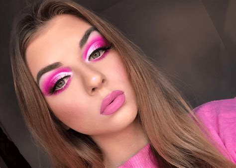 Barbie doll with bright pink eyeshadow and bold eyeliner