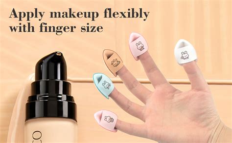 Close-up of a finger blending cream concealer onto the skin.