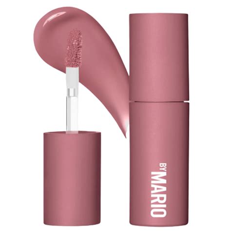 Beauty editor Megan Decker wearing Makeup By Mario Plumping Lip Color in Hot Pink.
