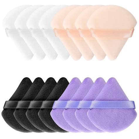 A variety of powder puffs in different shapes and sizes, including traditional round puffs, triangle puffs, and puffs with handles.