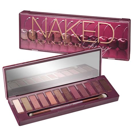 Swatches of the Urban Decay Naked Cherry eyeshadow palette shades on different skin tones.