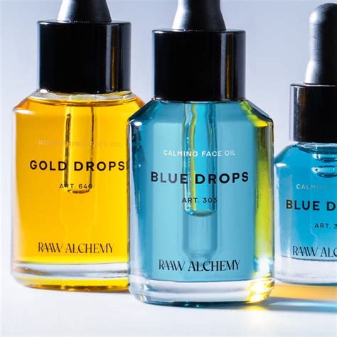 Close-up of Raaw Alchemy Blue Oil bottle with botanical elements