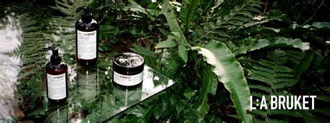 L:A Bruket products displayed with natural elements like wood and shells