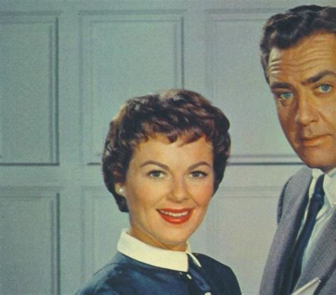 Barbara Hale as Della Street and Raymond Burr as Perry Mason in their office.