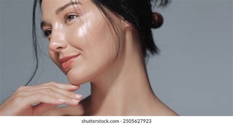 Close-up of a woman's face with glowing, well-moisturized skin, showcasing a natural foundation finish.