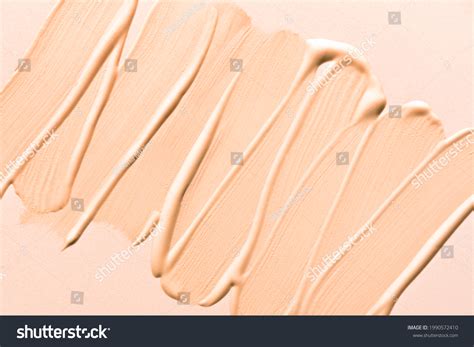 Close-up of various color corrector textures: cream, liquid, powder