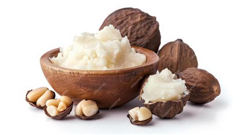 Close-up image of raw shea butter nuts and its creamy texture.