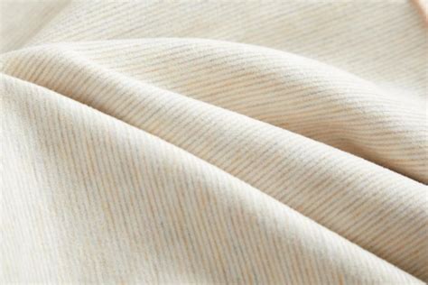 Close-up photo of the cotton twill fabric and leather logo patch