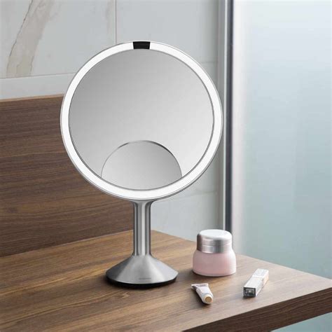 The Simplehuman Sensor Mirror Trio highlighting its automatic sensor and dual-sided magnification