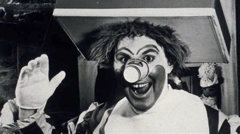 Illustration of the early Ronald McDonald costume with cup nose and tray hat