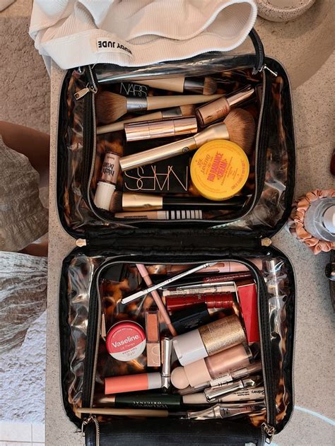 A neatly organized makeup bag containing essential, multi-use products for a quick routine.