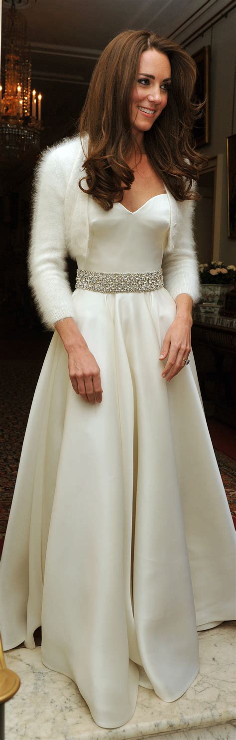 Kate Middleton at a wedding in 2006, showcasing a natural makeup style with long waves.