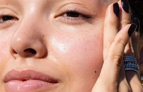 Close-up of sunscreen texture on skin, showing minimal white cast and dewy finish
