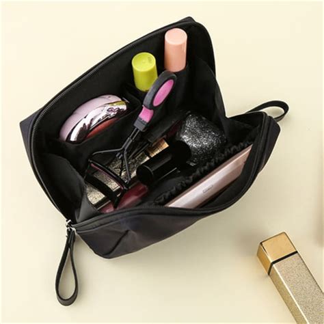 A collection of mini makeup products neatly arranged in a small cosmetic bag.
