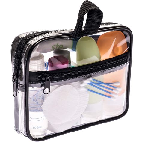 A clear TSA-approved toiletry bag filled with travel-sized liquids and creams.