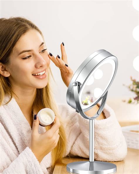 Close-up of a dual-sided makeup mirror, showing both the regular and magnifying sides