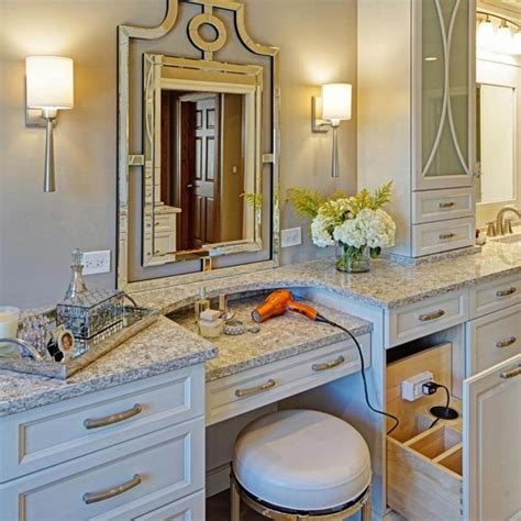An elegant makeup mirror placed on a bathroom vanity