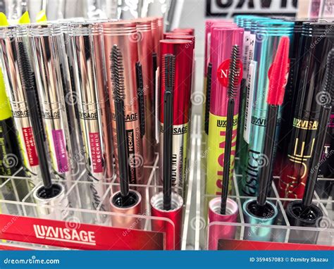 A diverse collection of mascara tubes showcasing various brands and wand types.