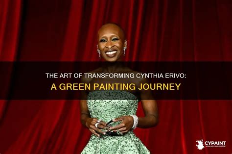 Makeup artists applying green body paint and prosthetics to Cynthia Erivo