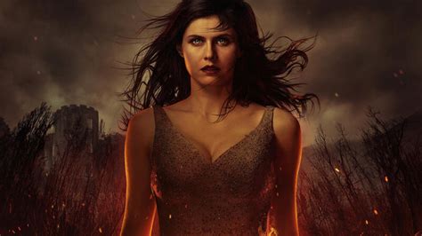 Alexandra Daddario in costume as a witch