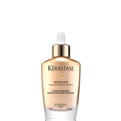 Close-up image of Kérastase Initialiste Advanced Scalp and Hair Concentrate serum being applied to hair.