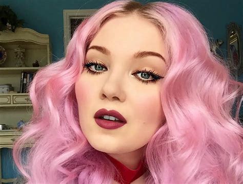 Portrait of Doe Deere, founder of Lime Crime, with a vibrant makeup look.