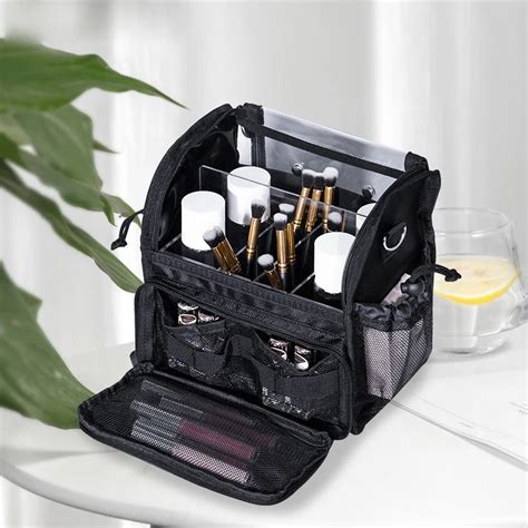 A well-organized travel makeup bag with clear compartments and brush holders.