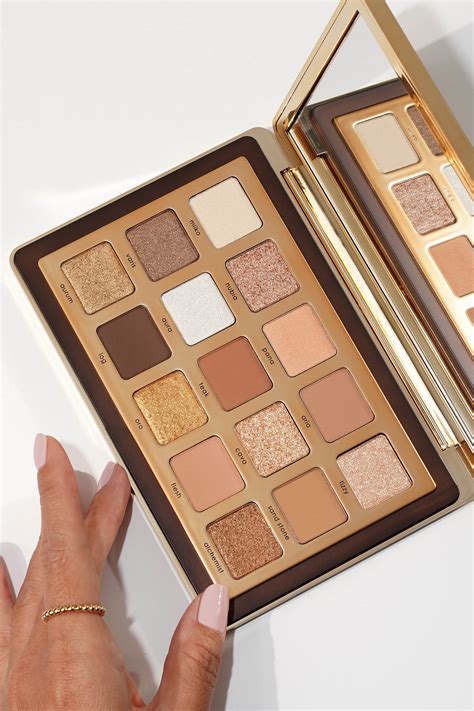 A collection of Natasha Denona eyeshadow palettes in various sizes and color schemes.