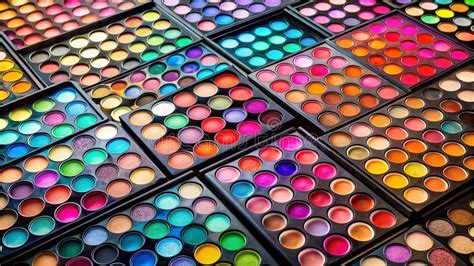 A diverse collection of eyeshadow palettes with various finishes and colors.