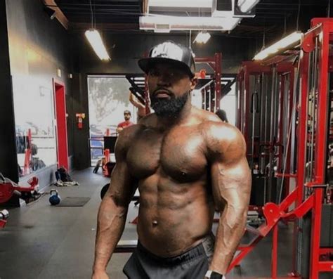 Mike Rashid posing with a muscular physique