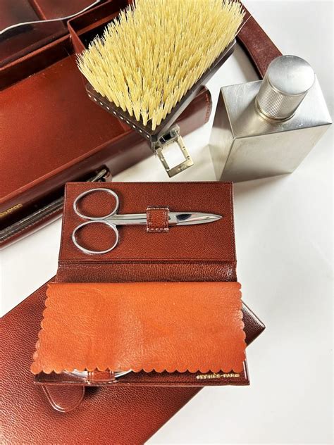 An elegant vintage Hermès travel case, showcasing its sophisticated design and the historical concept of portable grooming kits.