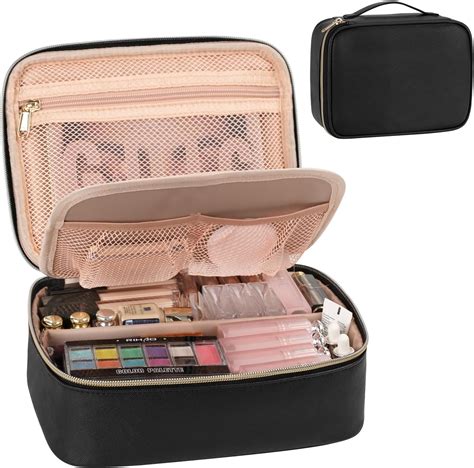 A travel makeup bag opened to reveal multiple compartments, brush holders, and spill-resistant lining.