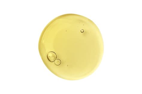 Close-up of a serum applicator wand and a swatch of serum texture on skin