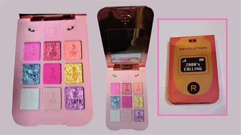 Close-up of the Makeup Revolution Y2K Baby Flip Phone eyeshadow palette, highlighting the flip phone design and eyeshadow pans.