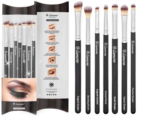 Close-up of eye makeup application with brushes