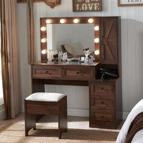 A dark brown makeup vanity with integrated LED lights, showcasing its sleek design and ample storage drawers.