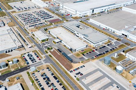 An aerial view of Galderma's large manufacturing facility in Baie-D'Urfé, Canada, highlighting its scale and modern infrastructure.