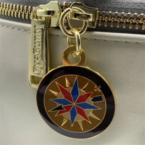 A detailed shot of a Loungefly bag's zipper pull charm and metal plaque, highlighting quality craftsmanship.