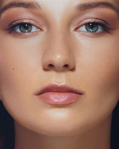 A close-up shot of a mature woman's face, showcasing smooth, well-applied foundation and concealer.