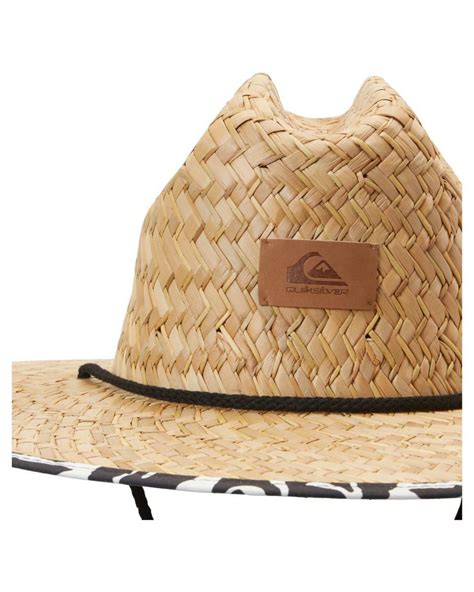 Close-up of a Quiksilver straw sun hat, highlighting its weave and brim.