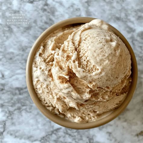 A scoop of brown sugar cinnamon ice cream with a sprinkle of cinnamon