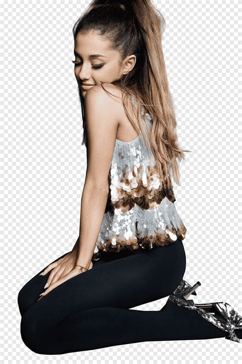 Ariana Grande sitting on a sink applying makeup, black and white photo