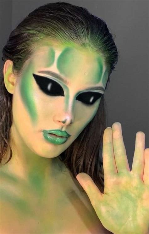 Abstract alien eye makeup with lime green streaks and green mascara