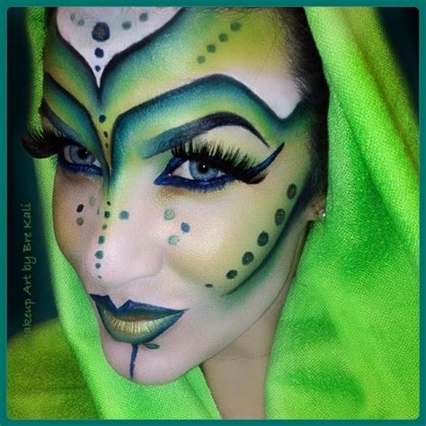 Classic green alien makeup with large eyes and contouring