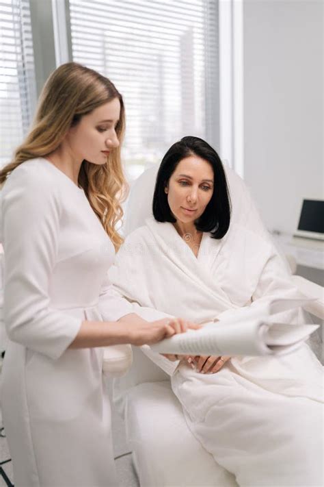 Aesthetician consulting with a client